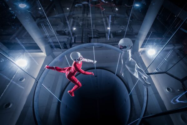 Dramatic Photo Of Couple Flying At Flow Moscow Indoor Skydiving