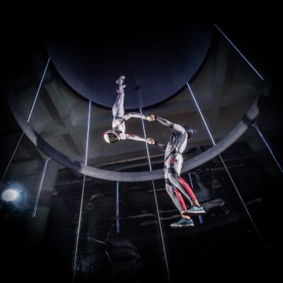 Dramatic Photo Of Couple Flying At Flow Moscow Indoor Skydiving