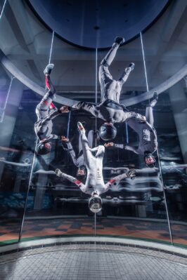 Dramatic Photo Of Group Flying At Flow Moscow Indoor Skydiving