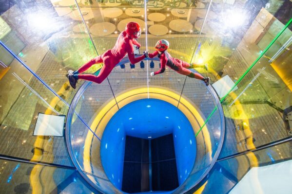 Couple Flying Together In Wind Tunnel