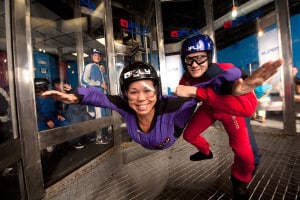 A woman enjoys her first flight in iFLY Orlando, Florida.